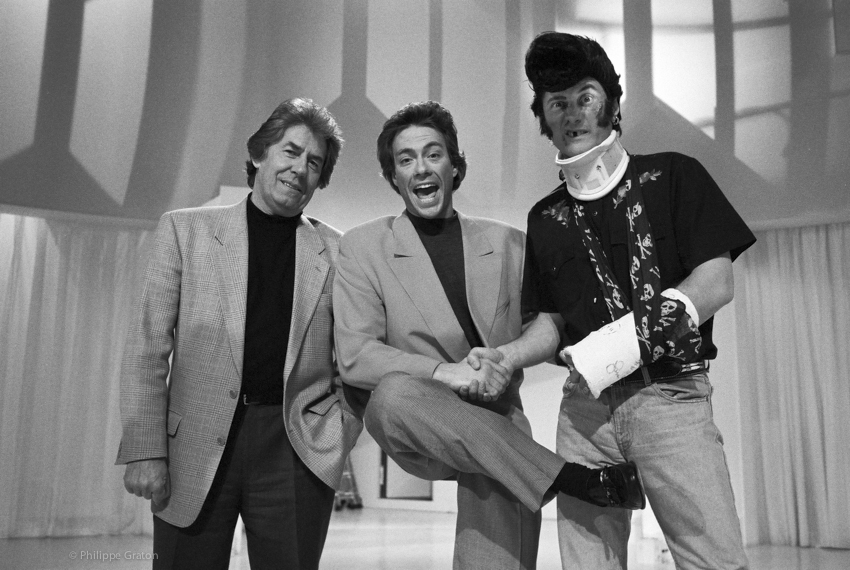 Jean-Claude Van Damme with French TV stars Philippe Gildas and Antoine de Caunes. Paris, 1993.